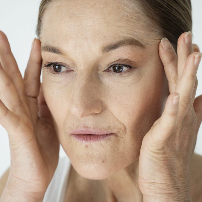 senior-woman-lifting-face-close-up